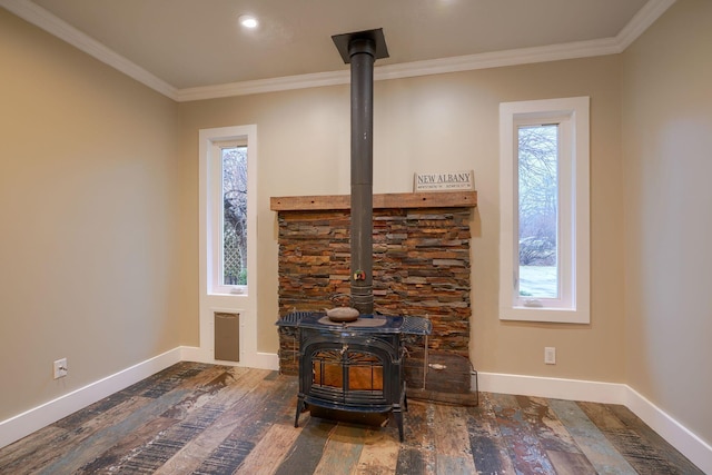 room details featuring crown molding, hardwood / wood-style floors, and a wood stove