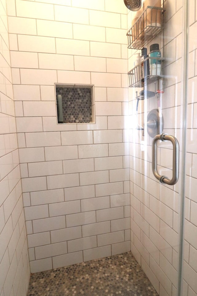 bathroom featuring an enclosed shower