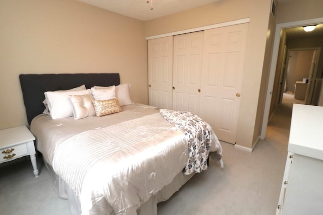 carpeted bedroom featuring a closet