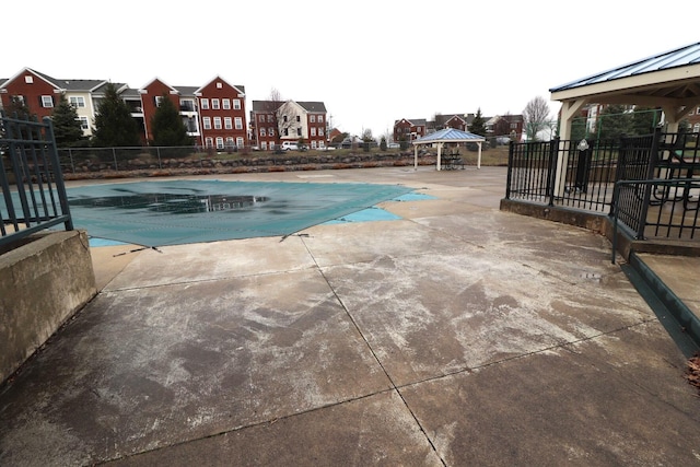 view of swimming pool featuring a gazebo and a patio