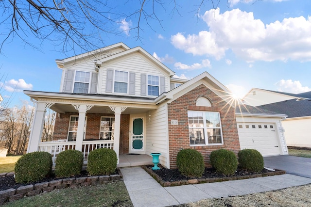 view of front of home with a porch and a garage