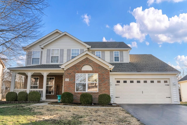 front of property with a garage and covered porch