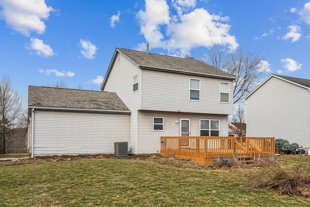 back of house featuring a wooden deck, central AC, and a lawn