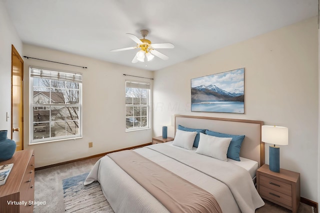 carpeted bedroom with ceiling fan