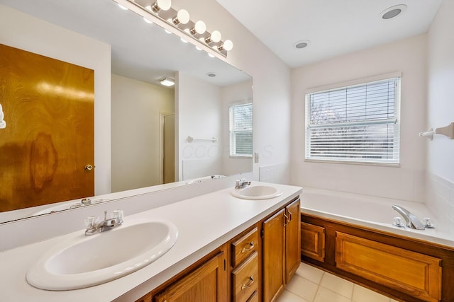 bathroom with tile patterned floors, independent shower and bath, and vanity