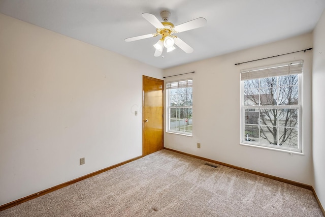 unfurnished room featuring carpet floors and ceiling fan