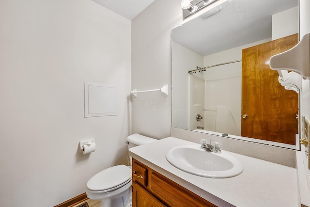 full bathroom featuring vanity, bathtub / shower combination, and toilet