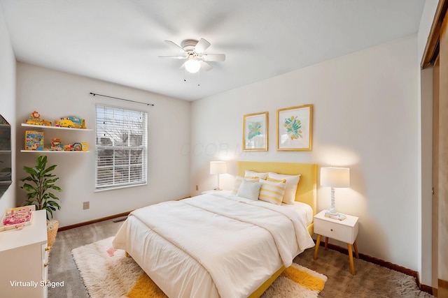 bedroom with dark carpet and ceiling fan