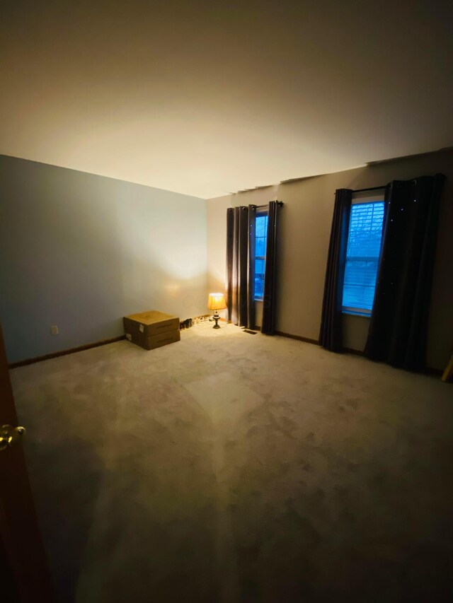 empty room with carpet flooring