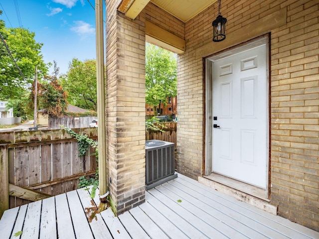 view of exterior entry with central air condition unit