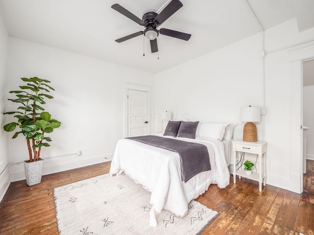 bedroom featuring ceiling fan and dark hardwood / wood-style flooring