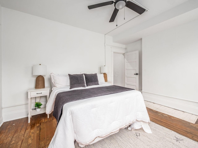 bedroom featuring ceiling fan and dark hardwood / wood-style flooring