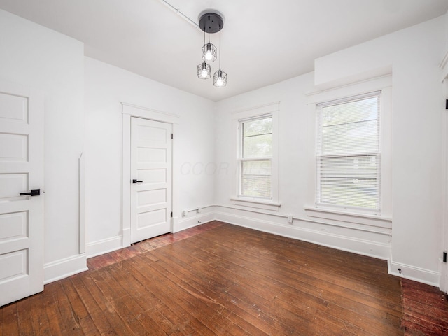 empty room featuring dark hardwood / wood-style floors