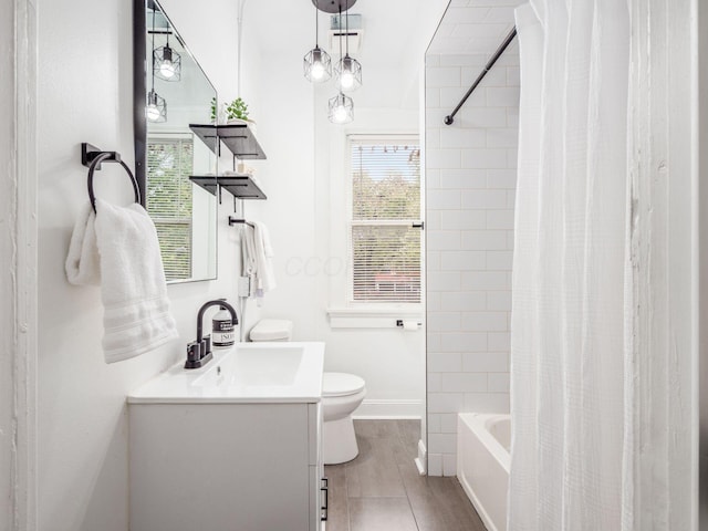 full bathroom with shower / bath combination with curtain, vanity, toilet, and wood-type flooring