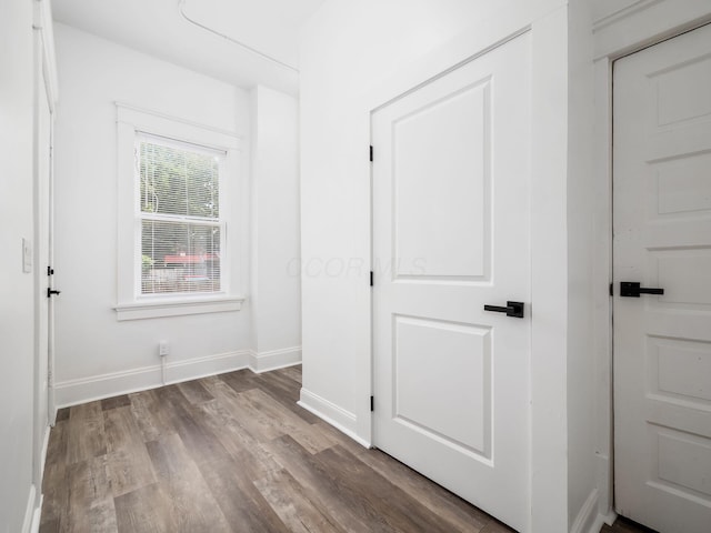 unfurnished bedroom with wood-type flooring