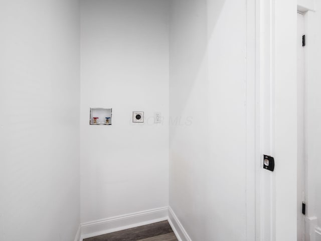 washroom with hookup for an electric dryer, dark hardwood / wood-style flooring, and hookup for a washing machine