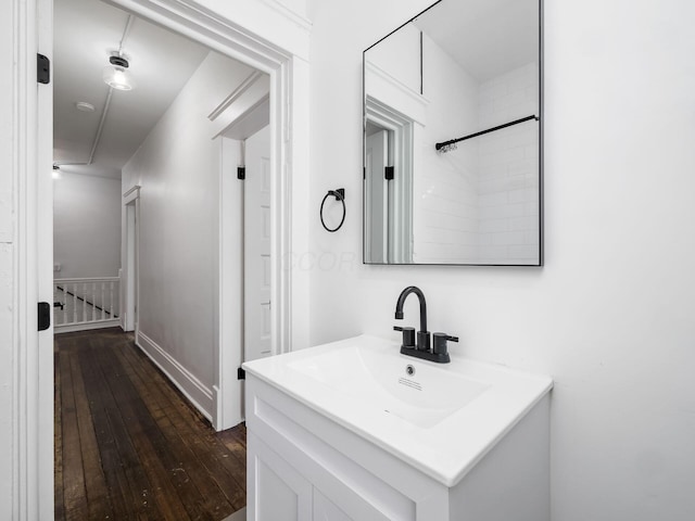 bathroom with vanity and hardwood / wood-style floors