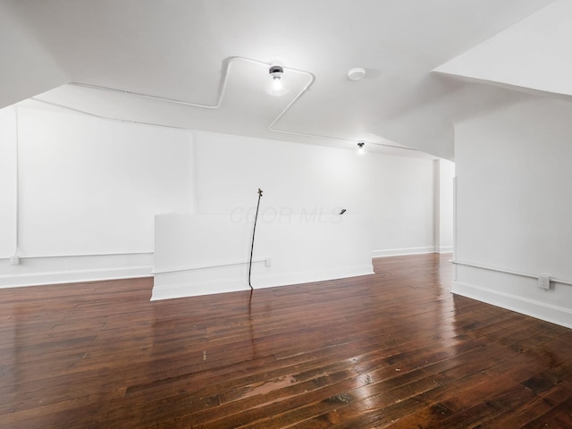 unfurnished room featuring dark hardwood / wood-style floors