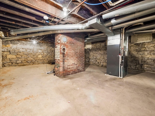 basement featuring heating unit