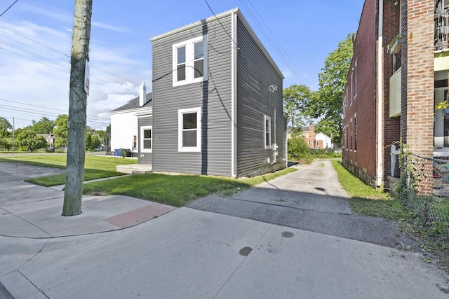 view of property exterior featuring a yard