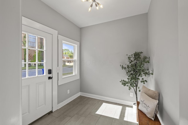 doorway featuring an inviting chandelier