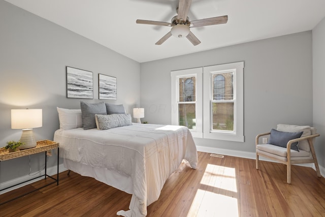 bedroom with hardwood / wood-style flooring and ceiling fan