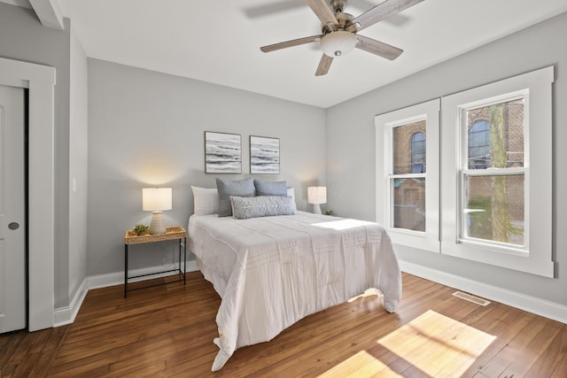 bedroom featuring ceiling fan and dark hardwood / wood-style flooring