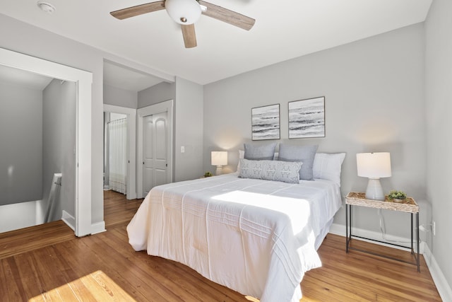 bedroom with ceiling fan and hardwood / wood-style floors