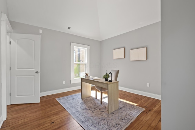 office space featuring hardwood / wood-style floors and high vaulted ceiling