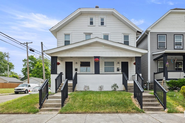 view of front of property featuring a porch and a front yard