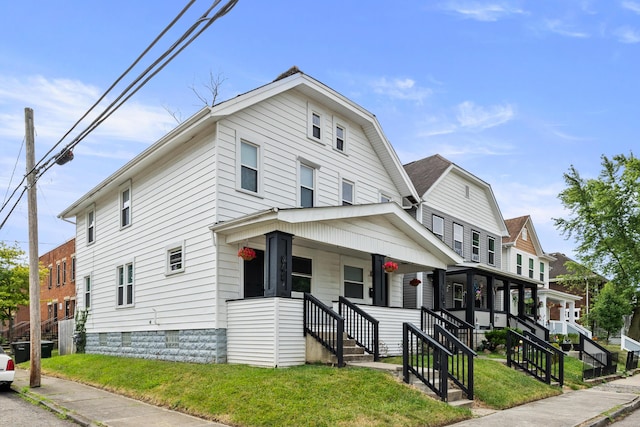 view of front of house featuring a porch and a front lawn