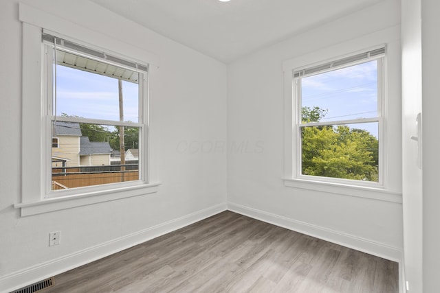 empty room featuring hardwood / wood-style flooring