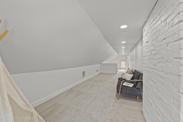 sitting room with light carpet and lofted ceiling