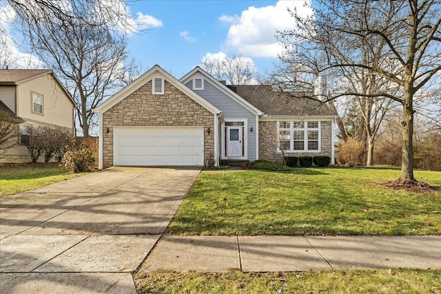 view of front of house with a garage and a front yard