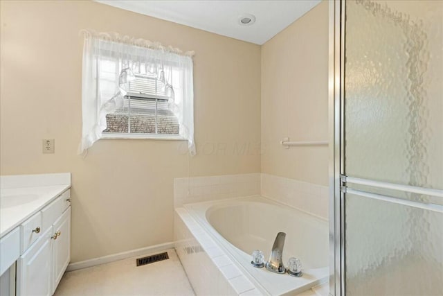 bathroom with vanity and plus walk in shower