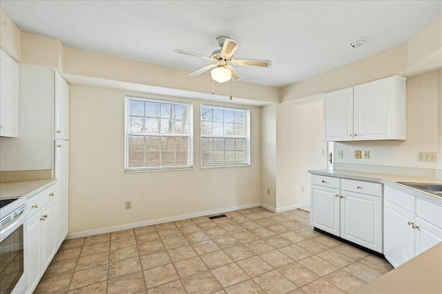 kitchen featuring white cabinetry, white range with electric cooktop, and ceiling fan