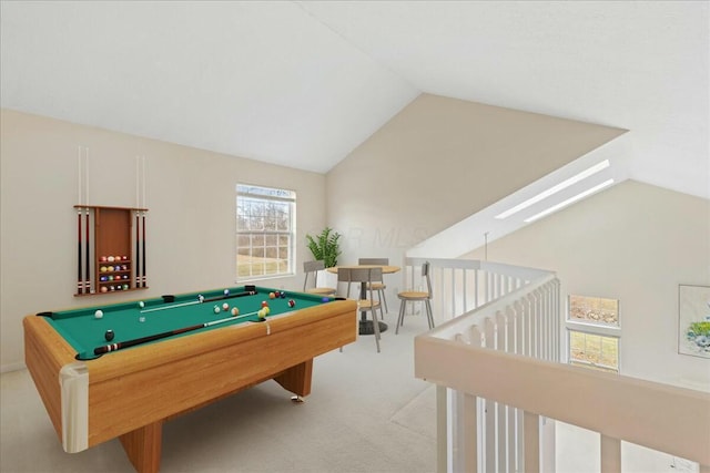 playroom featuring light colored carpet, lofted ceiling with skylight, and pool table