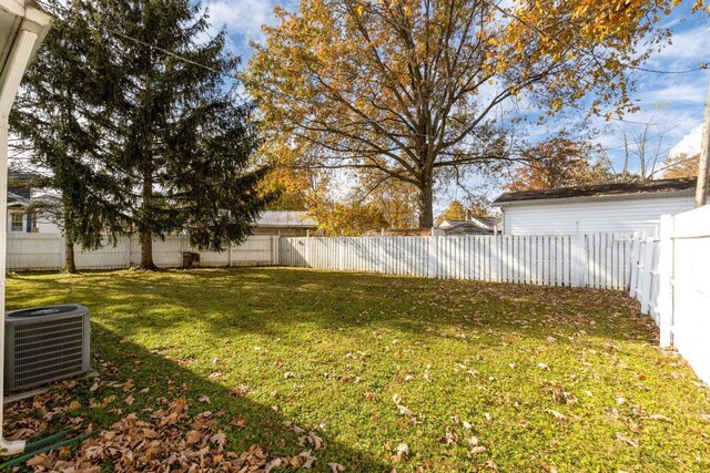 view of yard featuring central AC unit