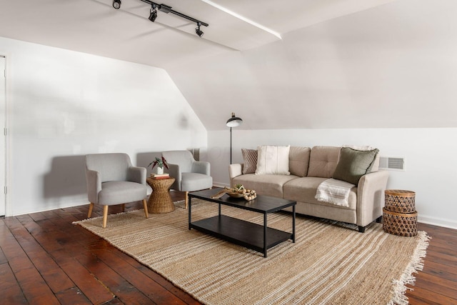 living room featuring wood-type flooring, lofted ceiling, and track lighting