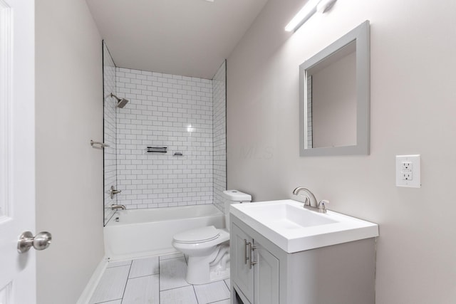 full bathroom featuring vanity, toilet, and tiled shower / bath