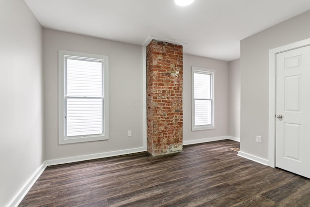 unfurnished living room featuring dark hardwood / wood-style flooring