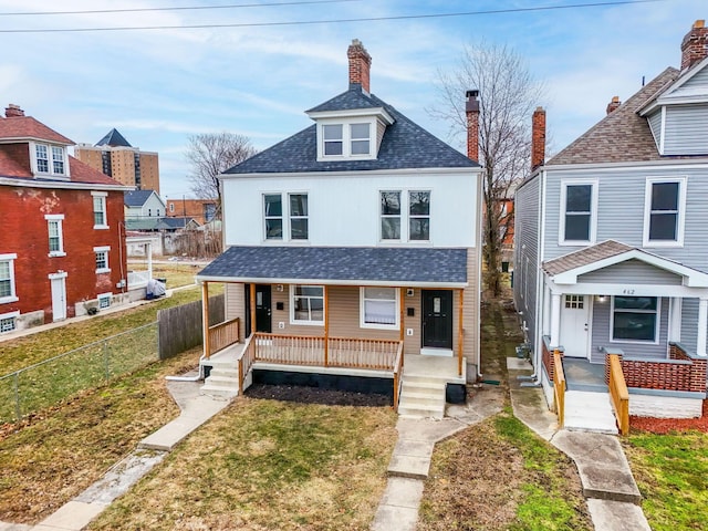 bungalow-style house with a front lawn and covered porch