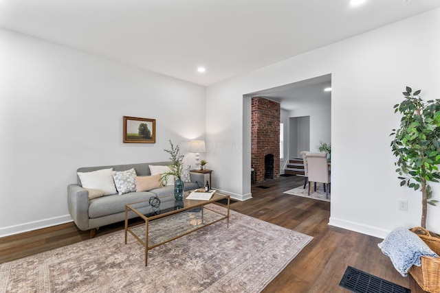 living room featuring dark hardwood / wood-style floors