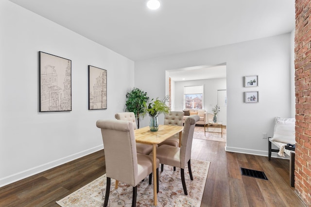 dining space featuring dark hardwood / wood-style flooring