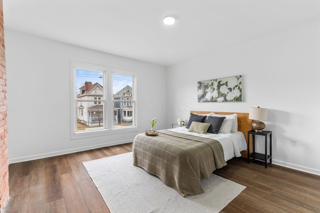 bedroom featuring dark hardwood / wood-style flooring