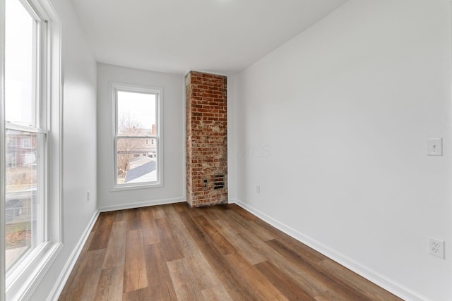 unfurnished room with light wood-type flooring