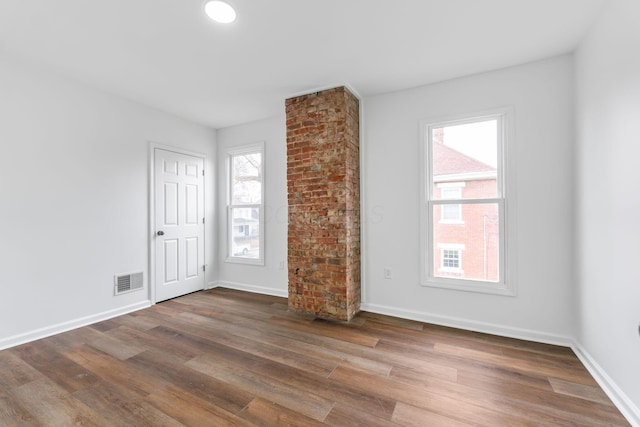 spare room featuring dark hardwood / wood-style floors