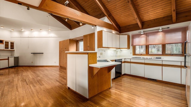 kitchen featuring black dishwasher, kitchen peninsula, light hardwood / wood-style flooring, and white cabinets