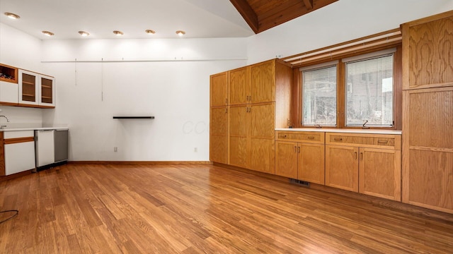 interior space featuring high vaulted ceiling and light wood-type flooring