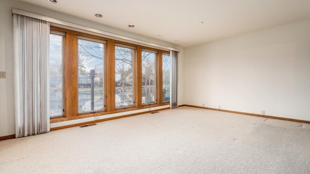 empty room featuring carpet flooring